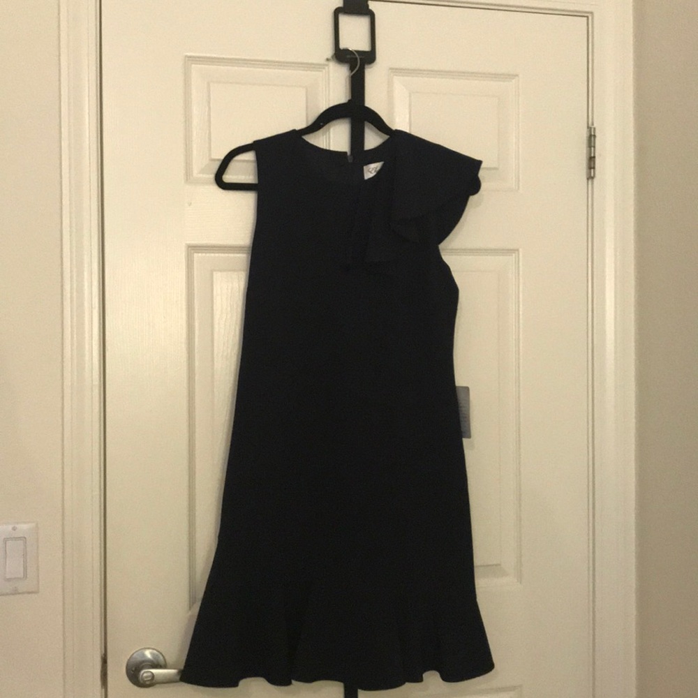 Navy blue ruffle shouldered dress.